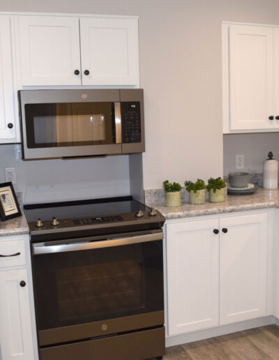 Quarryville kitchen showing oven, stove, and refrigerator.