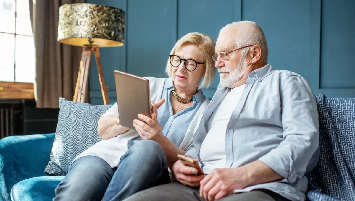 couple learning how to choose the best retirement community Couple wearing blue button down shirts, learning how to choose the best retirement community.