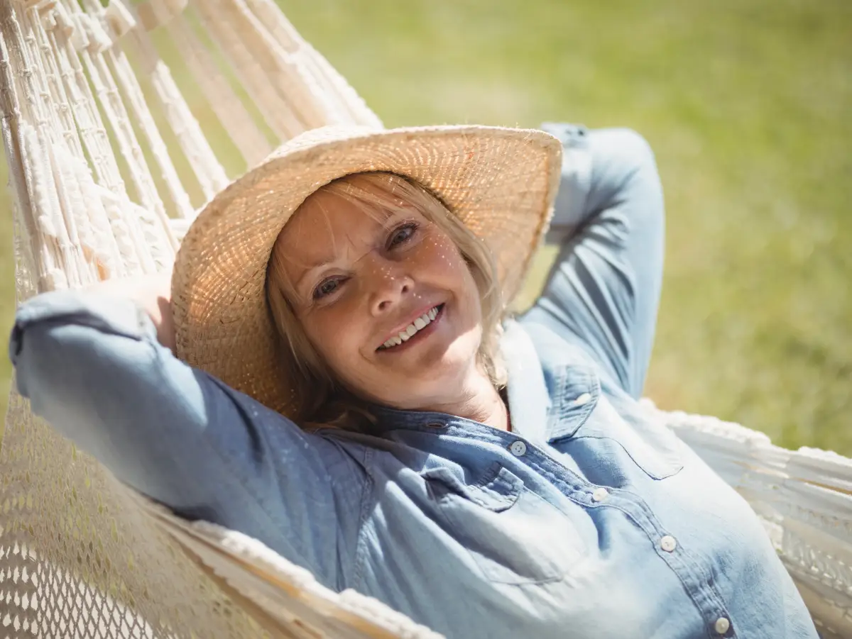 woman relaxes because she learned why people move to retirement communities.
