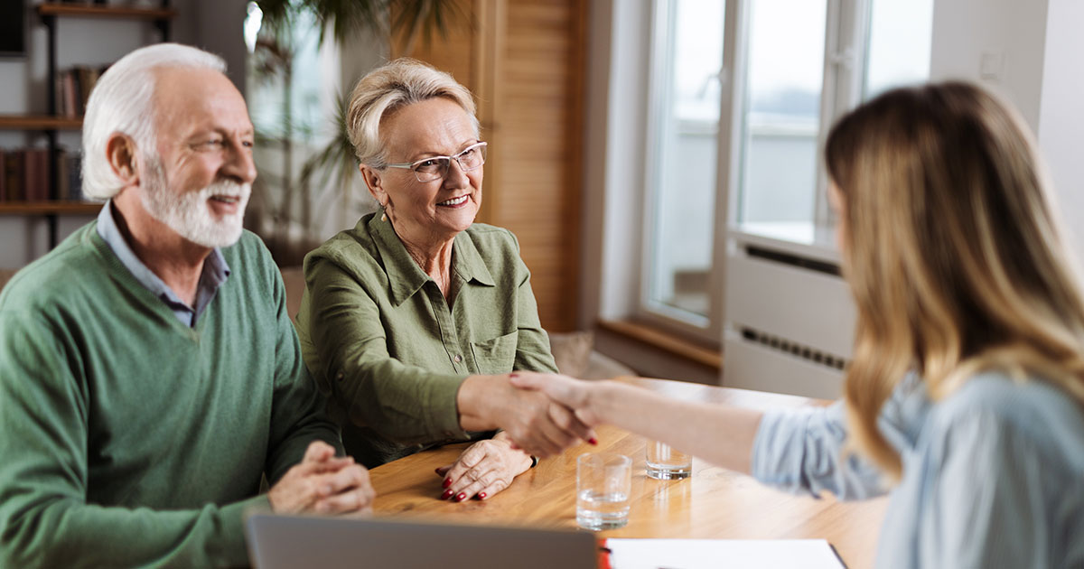 Retired couple asks questions at a Life Plan Community Open House.